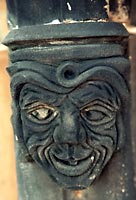 Carved, leering grotesque face