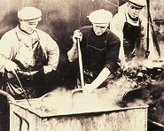  Fishermen working with nets on board drifter 'Cosmea' preserving nets, c1939 