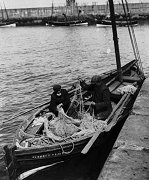 Sorting nets aboard the 'George Liston' in Newhaven Harbour, c1900