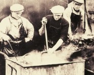 Fishermen preserving nets in alum aboard Cellardyke drifter Cosmea, c1935