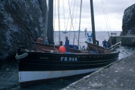 Restored fifie 'the Reaper' entering Dunbar Harbour, 2002