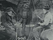 Fishermen mending nets, c1900