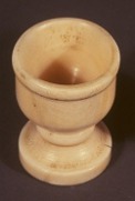 Egg cup made from sperm whale tooth, made around 1935, held in the Scottish Fisheries Museum